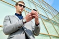 Handsome Businessman Using Smartphone Outdoors Royalty Free Stock Photo