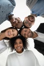 Low angle portrait of smiling diverse employees together