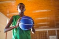 Low angle portrait teenager holding ball Royalty Free Stock Photo