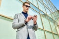 Young Businessman Using Smartphone Outdoors Royalty Free Stock Photo