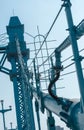 Low angle of power station electricity powr with metal pipes under blue sky