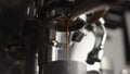 Low angle of pulling espresso shot with naked portafilter