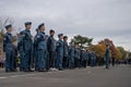 Low-angle regiment of soldiers standing outdoors for Remembrance Day in Victoria, Canada