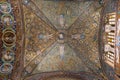 Low angle of religious mosaics on the ceiling and walls in San Vitale Basilica, Italy