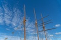 Low-angle of a sailing boat mast with a blue cloudy sky in the background Royalty Free Stock Photo