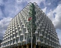 Low angle shot of the American Embassy of London under the cloudy sky