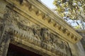 Low angle shot of an ancient carving on top of entrance stone arch