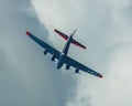 Low angle shot of B-17G flying fortress Texas Raiders in the cloudy sky Royalty Free Stock Photo