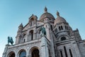 Low angle shot of The Basilica of the Sacred Heart of Paris under a blue sky in France