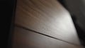 low angle shot of black walnut under tv cabinet