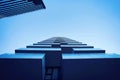 Low angle shot of a blue modern architecture building with the sky in the background Royalty Free Stock Photo