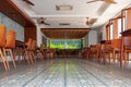 Low angle shot of a cafe with wooden chairs and tables in Phnom Penh in Cambodia Royalty Free Stock Photo