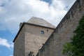 Low angle shot of a castle roof on a bright cloudy sky background Royalty Free Stock Photo