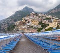 low angle shot of chairs and umbrellas on positano beach of the amalfi coast