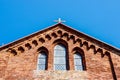 Low angle shot of a church roof with a cross on the top Royalty Free Stock Photo