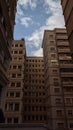 Low-angle shot of a cityscape featuring a row of apartment buildings Royalty Free Stock Photo