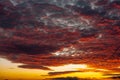 Low angle shot of clouds in a blue sky with a beautiful rising sun