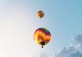 Low-angle shot of the colorful hot air ballons flying in the blue sky Royalty Free Stock Photo