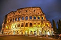 Low angle shot of Colosseum with lights in the center of Rome, Italy at night time Royalty Free Stock Photo