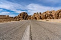 Low angle shot of an empty asphalt road in the desert Royalty Free Stock Photo