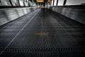 Low angle shot of an escalator with dirtproof grating Royalty Free Stock Photo