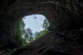 Low angle shot of the exit of a dark cave in Skrad, Croatia