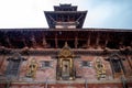 Low angle shot of an exterior of the Patan Museum against a cloudy blue sky in Kathmandu, Nepal