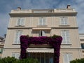 Low angle shot of a facade of a beautiful beige villa in Monaco-Ville, Monaco