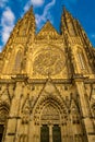 Low angle shot of the facade of St. Vitus Cathedral in Prague, Czech Republic, against a blue sky Royalty Free Stock Photo