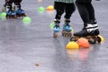 Low angle shot of family, young mother and children ride in a roller-skating at park