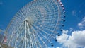 Low angle shot of a Ferris wheel and a blue sky Royalty Free Stock Photo