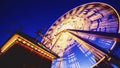 Low angle shot of a Ferris wheel on Chicago Navy Pier during the evening time