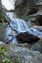 Low-angle shot of the frozen Ebentaler waterfall with large rock formations in winter Royalty Free Stock Photo