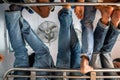 Overhead row of jeans in a overcrowded train in India