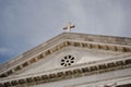 Low angle shot of a historic building roof with a cross in Venice, Italy Royalty Free Stock Photo