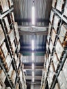 Low-angle shot of an illuminated corridor of an industrial warehouse.