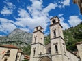 Low angle shot of Katedrala Svetog Tripuna cathedral on blue cloudy sky background in Montenegro Royalty Free Stock Photo