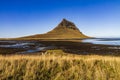 Low angle shot of the Kirkjufel mountain in Iceland and a river Royalty Free Stock Photo