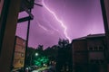 Low angle shot of a lightning strike in a beautiful purple sky Royalty Free Stock Photo