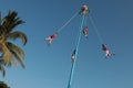 Low angle shot of Los voladores ceremony in Mexico