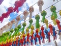 Low angle shot of a lot of colorful lanterns hanging from cables for a festival