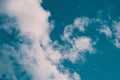 Low angle shot of the magnificent fluffy clouds in the blue sky