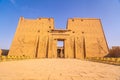 Low angle shot of the main entrance of The Temple of Horus at Edfu, Egypt
