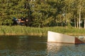 Low angle shot of man wakeboarding on a lake. Man water skiing at sunset. Royalty Free Stock Photo