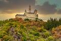 Low angle shot of Marksburg Castle on top of a hill with colorful trees in Braubach, Germany Royalty Free Stock Photo