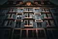 Low-angle shot of a medieval house with multiple floors on the street in Amsterdam Royalty Free Stock Photo