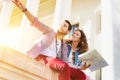 Low angle view of man holding map while sitting and talking to his girlfriend Royalty Free Stock Photo