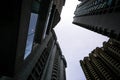 Low angle shot of modern glass city buildings with clear sky background. Royalty Free Stock Photo