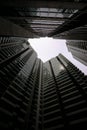 Low angle shot of modern glass city buildings with clear sky background. Royalty Free Stock Photo