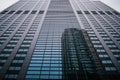 Low-angle shot of a modern skyscraper rising against the sky